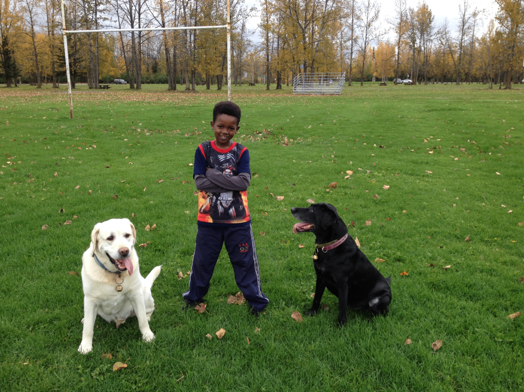 Saleh with two dogs at the park